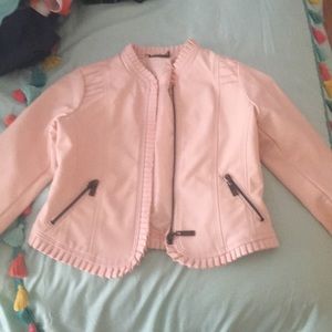 Pink leather jacket.